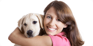 Woman hugging pet dog