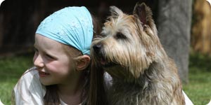 Girl with cairn terriers 