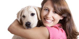 Girl hugging her pet dog